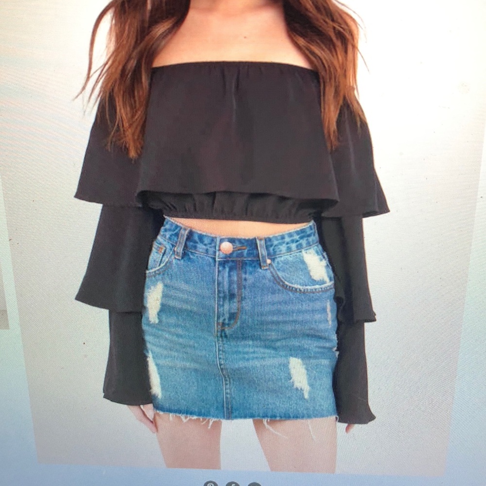 Distressed denim mini skirt